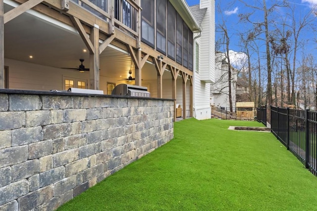 view of yard with ceiling fan