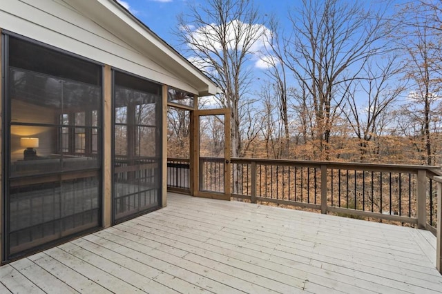 wooden deck featuring a sunroom