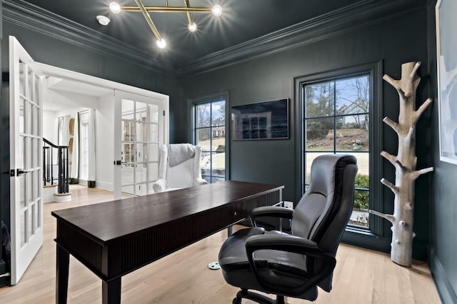 office space featuring french doors, ornamental molding, and light wood-type flooring