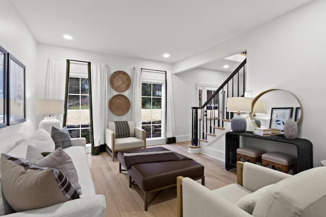 living room featuring plenty of natural light and light wood-type flooring