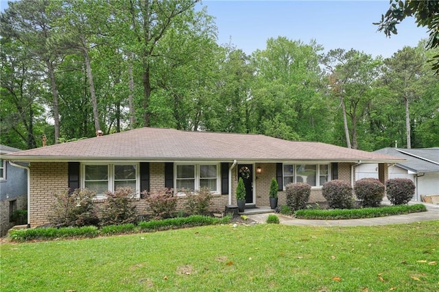 ranch-style home with a front lawn and brick siding