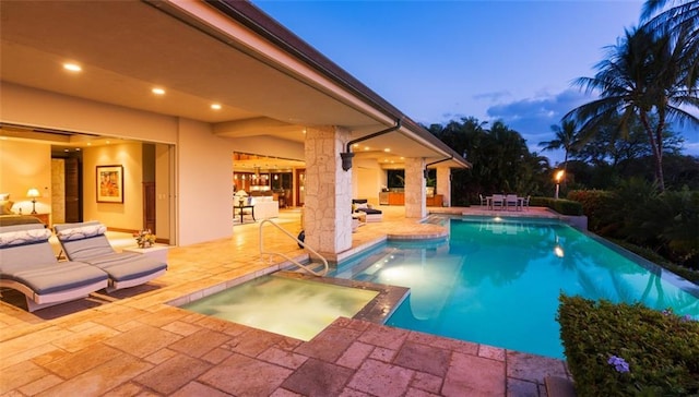 1103 Lynmoor Dr NE, Brookhaven, GA 30319 - pool at dusk with a patio area and an in ground hot tub