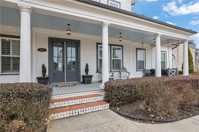 property entrance with covered porch