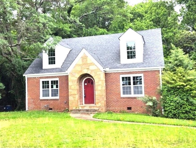 view of front of property featuring brick siding, crawl space, stone siding, and a front yard