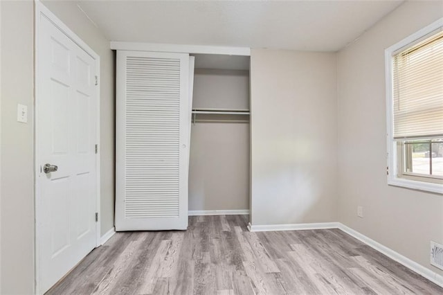 2172 SE Wakita Dr SE, Marietta, GA 30060 - unfurnished bedroom with wood finished floors, a closet, and baseboards