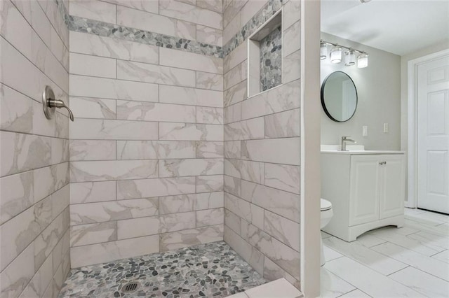 2172 SE Wakita Dr SE, Marietta, GA 30060 - full bathroom featuring a tile shower, marble finish flooring, vanity, and toilet
