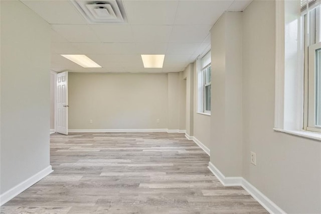2172 SE Wakita Dr SE, Marietta, GA 30060 - empty room with light wood-type flooring, a drop ceiling, and baseboards