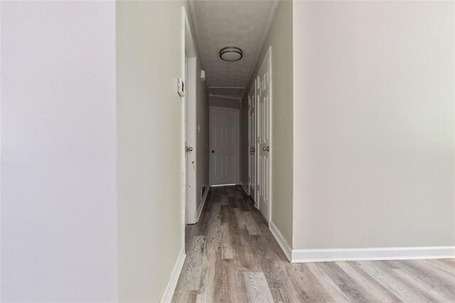 2172 SE Wakita Dr SE, Marietta, GA 30060 - hall featuring light wood-style flooring, baseboards, and a textured ceiling