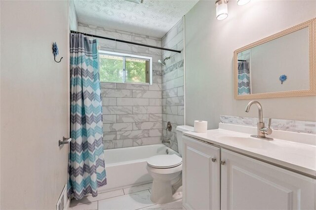 2172 SE Wakita Dr SE, Marietta, GA 30060 - full bath featuring vanity, shower / bath combo, toilet, marble finish floors, and a textured ceiling