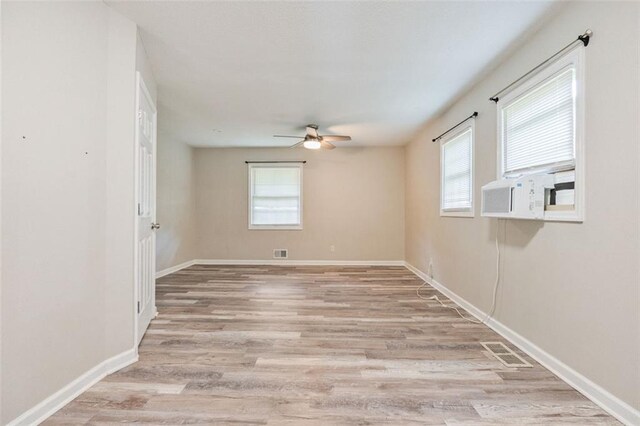 2172 SE Wakita Dr SE, Marietta, GA 30060 - spare room featuring ceiling fan, light wood-style flooring, cooling unit, and baseboards