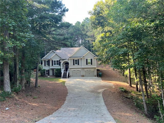 raised ranch with covered porch and a garage