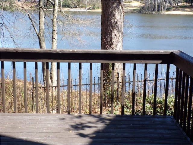 wooden terrace with a water view