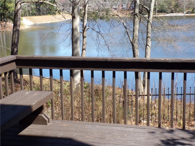 wooden deck with a water view