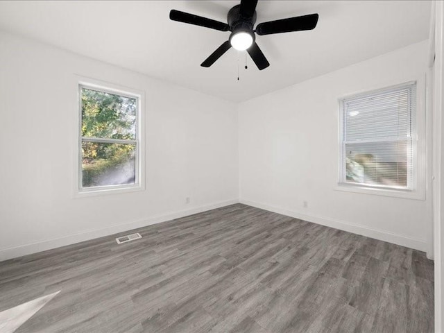 empty room featuring ceiling fan and hardwood / wood-style flooring