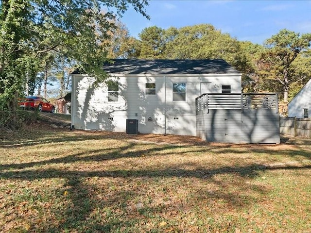 rear view of house with a lawn