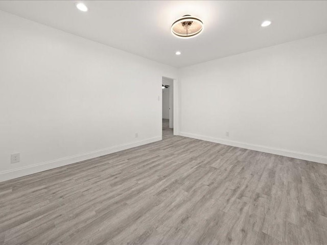 spare room with light hardwood / wood-style flooring