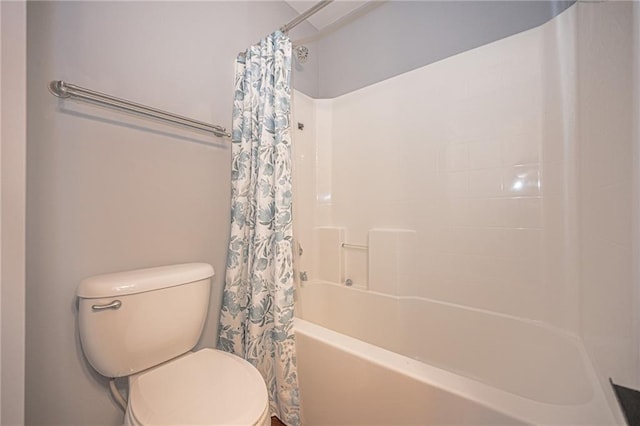 bathroom with shower / bathtub combination with curtain and toilet