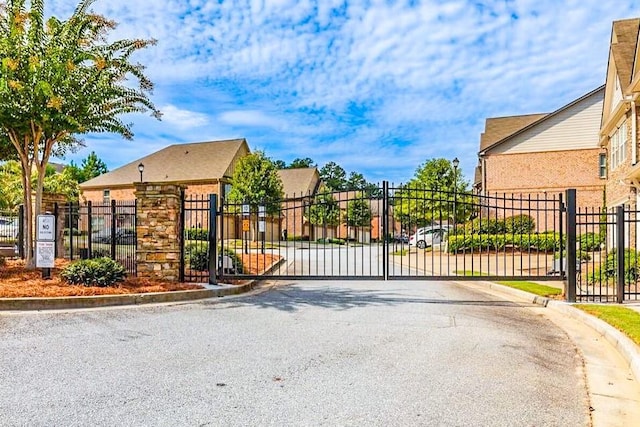 view of gate featuring fence