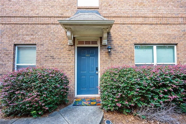 entrance to property with brick siding