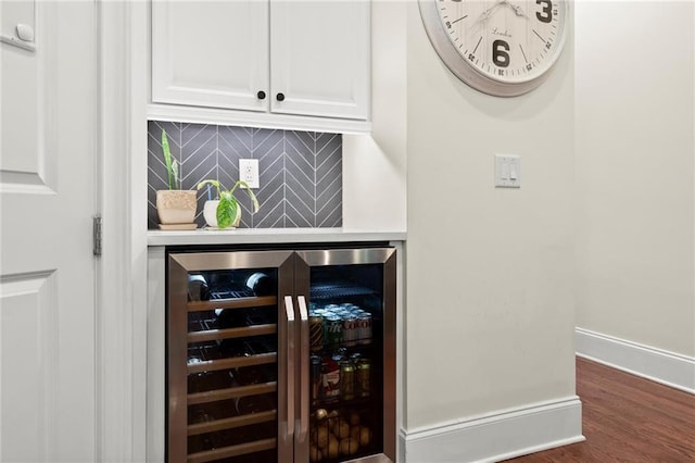 4896 Locklear Way, Marietta, GA 30066 - bar area featuring beverage cooler, backsplash, dark wood-style flooring, and baseboards
