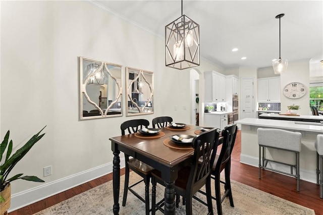 4896 Locklear Way, Marietta, GA 30066 - dining area with ornamental molding, wood finished floors, baseboards, arched walkways, and recessed lighting
