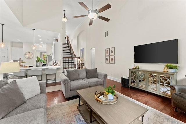 4896 Locklear Way, Marietta, GA 30066 - living room with wood finished floors, a ceiling fan, a towering ceiling, stairs, and recessed lighting
