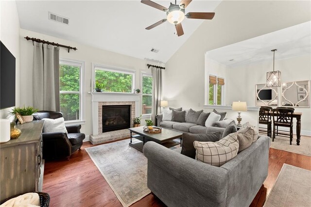 4896 Locklear Way, Marietta, GA 30066 - living room featuring plenty of natural light, ceiling fan, high vaulted ceiling, dark wood finished floors, and a brick fireplace