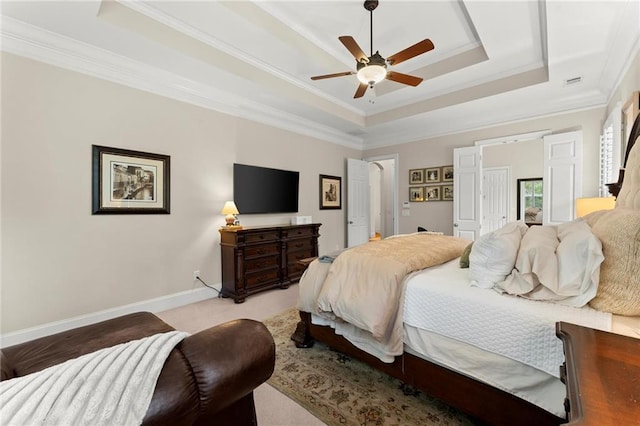 4896 Locklear Way, Marietta, GA 30066 - carpeted bedroom featuring a tray ceiling, crown molding, ceiling fan, and baseboards