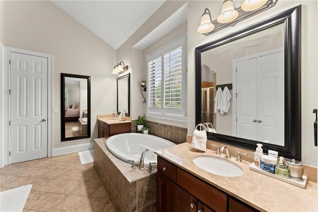 4896 Locklear Way, Marietta, GA 30066 - ensuite bathroom with vaulted ceiling, a bath, vanity, tile patterned flooring, and a shower