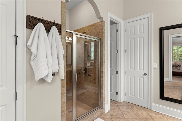 4896 Locklear Way, Marietta, GA 30066 - ensuite bathroom with a stall shower, baseboards, and tile patterned floors