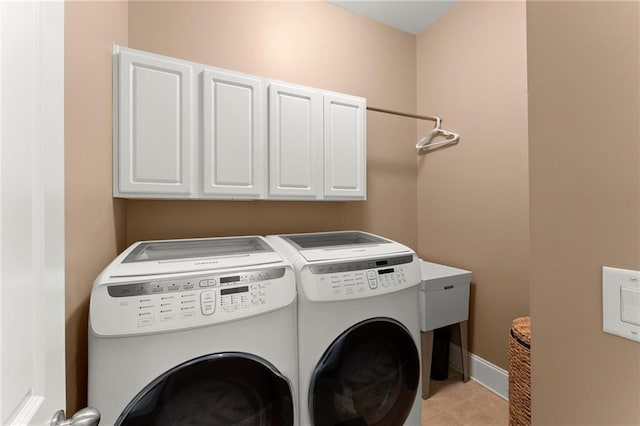 4896 Locklear Way, Marietta, GA 30066 - laundry area featuring cabinet space, separate washer and dryer, light tile patterned floors, and baseboards