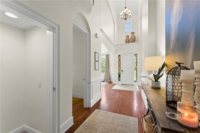 4896 Locklear Way, Marietta, GA 30066 - entrance foyer featuring dark wood-style flooring, arched walkways, a chandelier, baseboards, and a towering ceiling