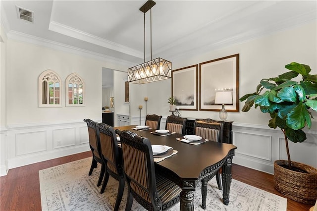 4896 Locklear Way, Marietta, GA 30066 - dining area featuring dark wood-type flooring, ornamental molding, a raised ceiling, wainscoting, and a decorative wall