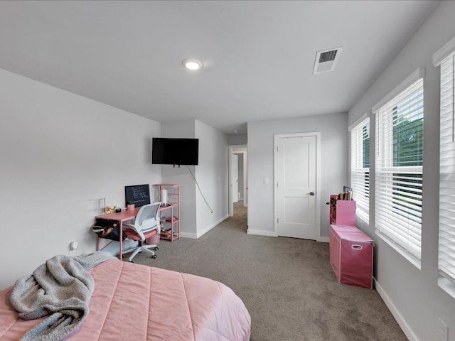 bedroom with carpet flooring, baseboards, and a desk
