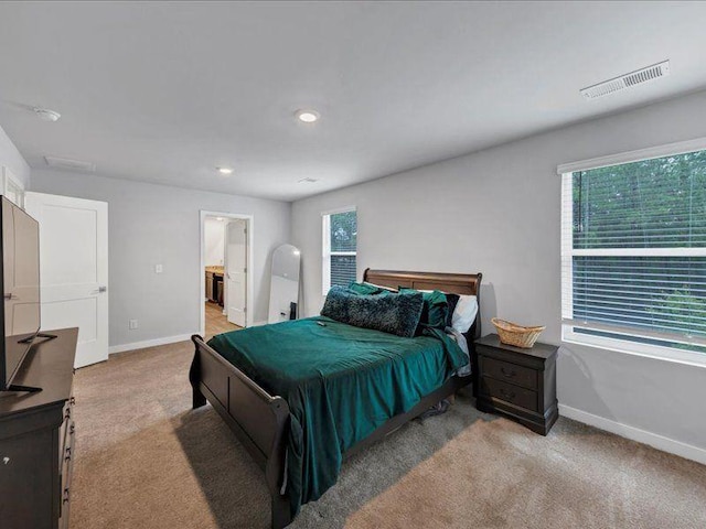 carpeted bedroom with baseboards, multiple windows, and recessed lighting