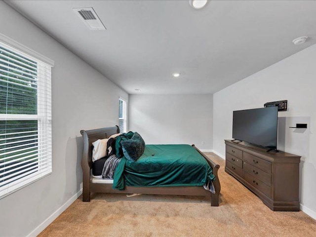 carpeted bedroom with baseboards and recessed lighting
