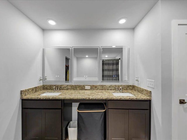 full bathroom featuring double vanity