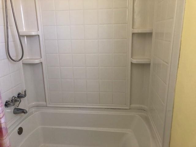 full bath featuring washtub / shower combination