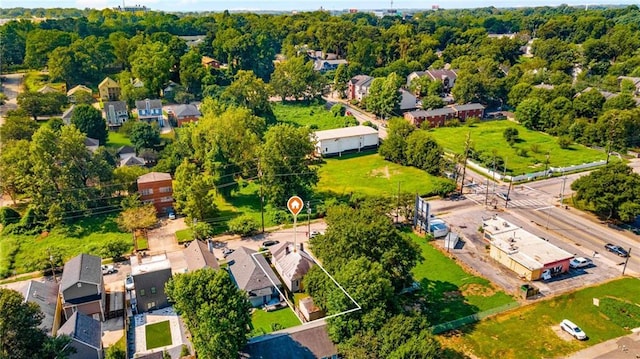 birds eye view of property with a residential view