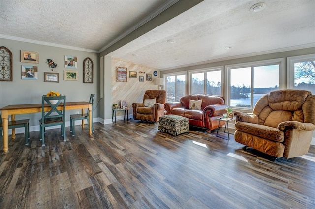 living room with a water view, a textured ceiling, ornamental molding, and dark wood-type flooring