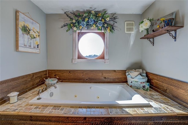 bathroom with a jetted tub