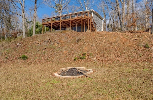 rear view of property featuring a deck