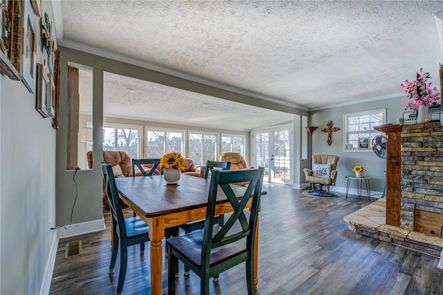 dining room with baseboards, french doors, dark wood finished floors, and crown molding