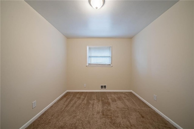 unfurnished room with carpet flooring