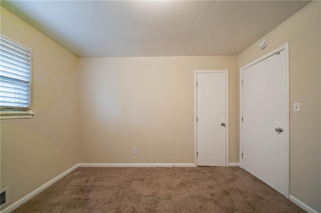 spare room with carpet flooring