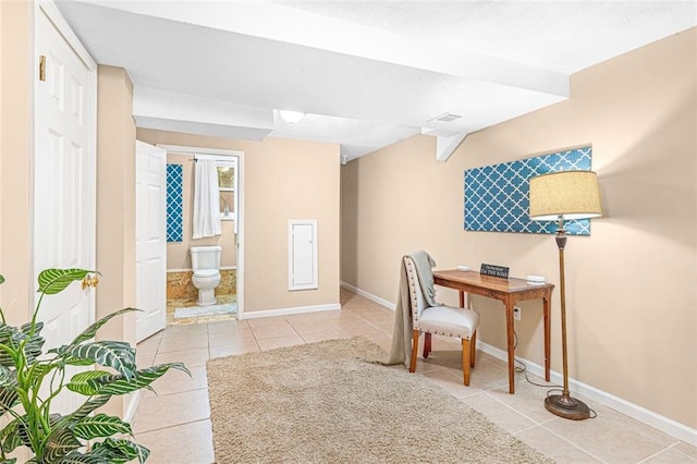 home office with light tile patterned floors, baseboards, and visible vents