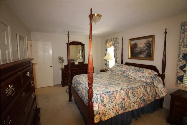 bedroom featuring light colored carpet