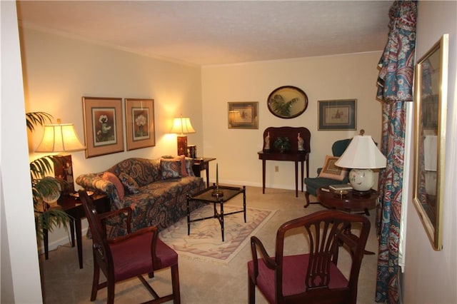 living area with ornamental molding and carpet