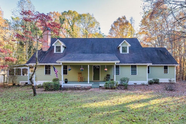 cape cod home featuring covered porch and a front yard