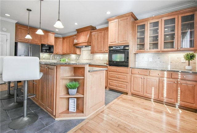 55 Little Barley Ln, Grayson, GA 30017 - kitchen featuring black appliances, open shelves, crown molding, custom range hood, and light stone counters